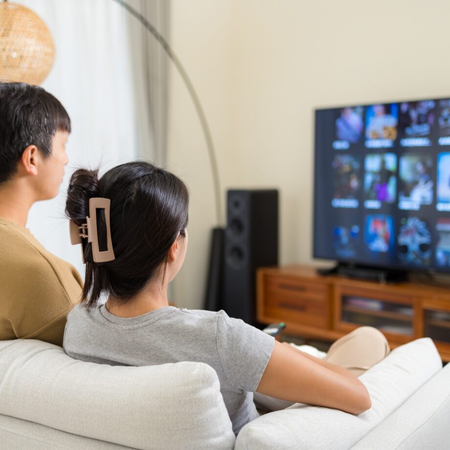Couple watch TV at home