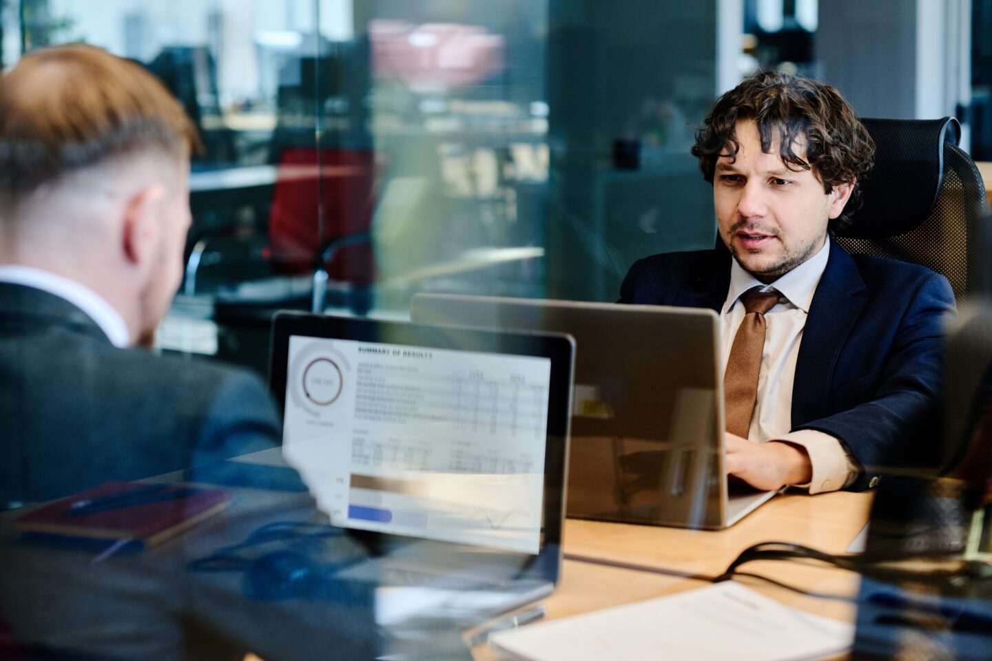 Business people examining financial marketing