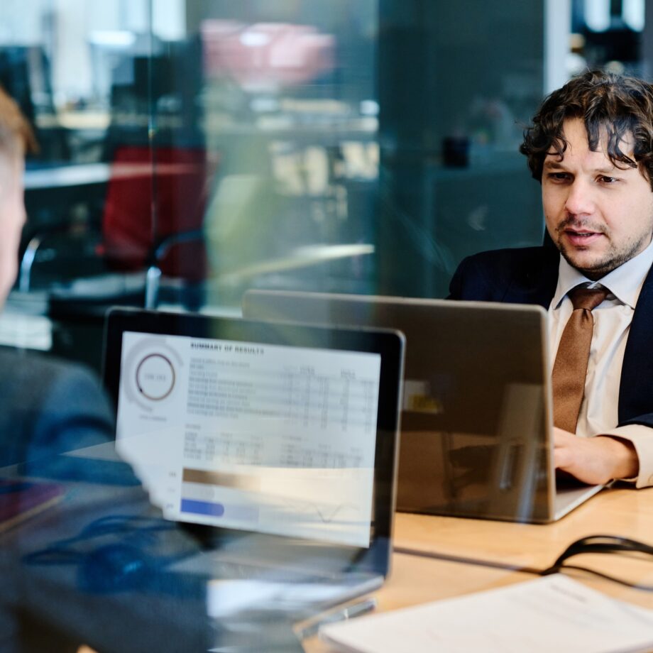 Business people examining financial marketing