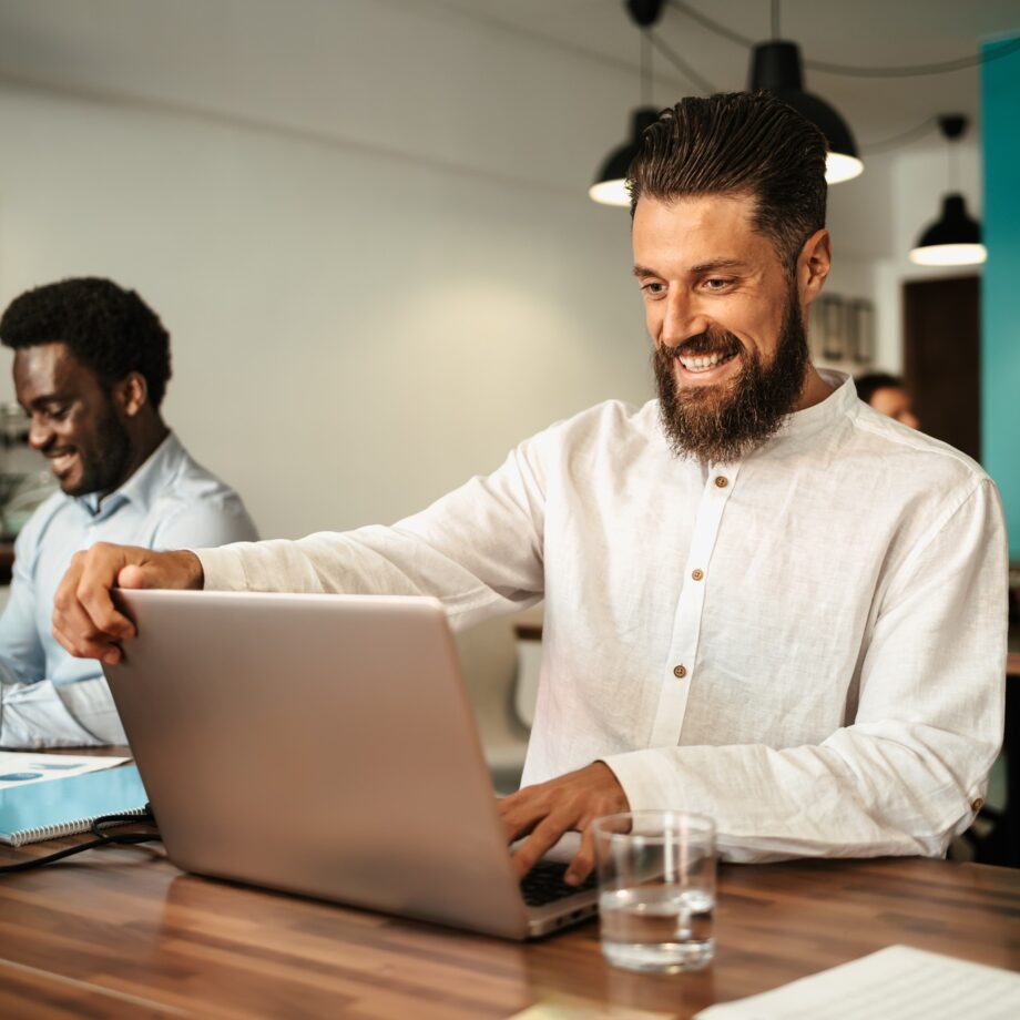 Multiracial people working inside coworking creative space