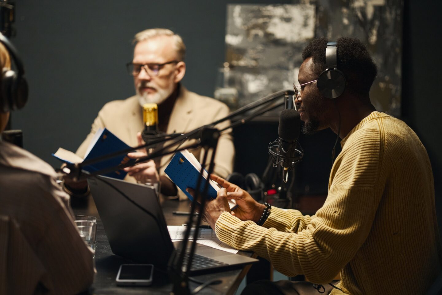 People Discussing New book During Podcast