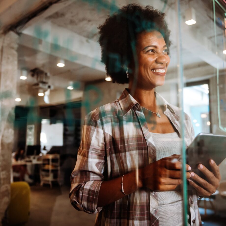 Software, coding and business woman on tablet thinking of data analytics, digital technology.
