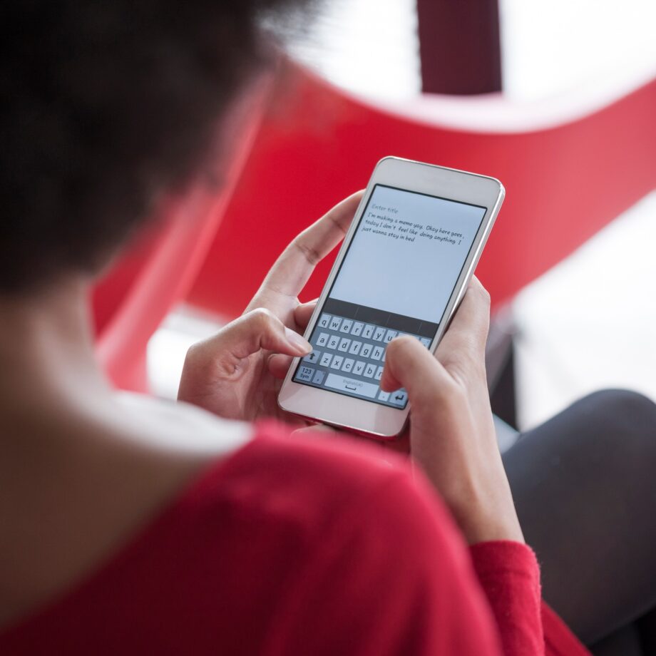 Woman text messaging on cell phone