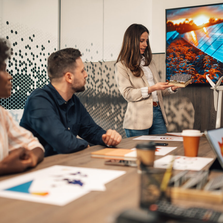 businesswoman with solar panels model having prese 2025 04 03 21 00 56 utc